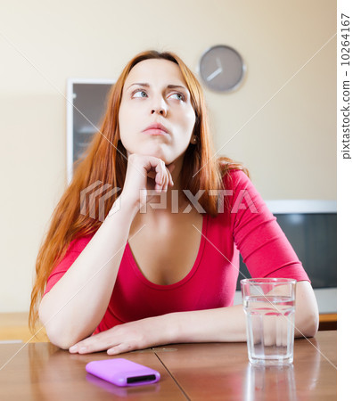 Sad woman with mobile 10264167