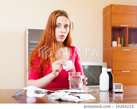Woman brewing herbal tea Woman brewing herbal tea 10264228
