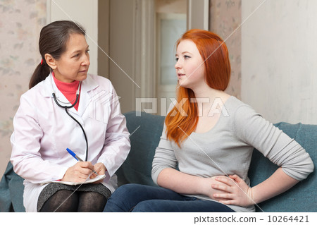 girl complaining to doctor about stomach ache girl complaining to doctor about stomach ache 10264421