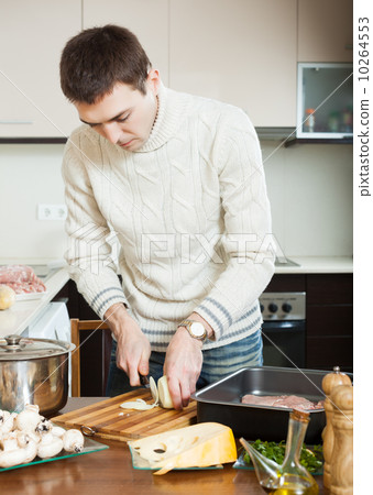 man Cooking french-style veal man Cooking french-style veal 10264553