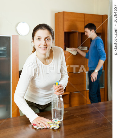 woman with husband cleaning room 10264657