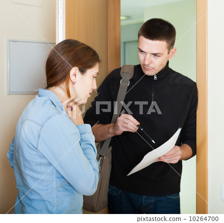 businessman trying to collect arrearages from woman 10264700