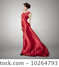 Young beauty woman in fluttering red dress. 10264793