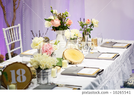 Elegant table set in green and white for wedding or event party. Elegant table set in green and white for wedding or event party. 10265541