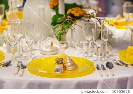 Elegant table set in soft creme and yellow for wedding or event 10265698
