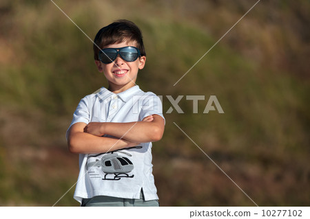 Admiring little boy laughing outdoors 10277102