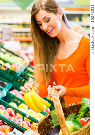 Woman in supermarket shopping groceries 10278831