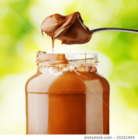A jar of hazelnut chocolate spread. A jar of hazelnut chocolate spread. 10281944