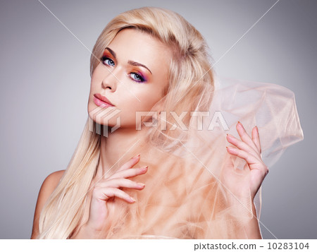 Sensual blonde woman covering by beige fabric. Sensual blonde woman covering by beige fabric. 10283104