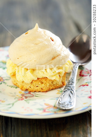 Plate with meringue and teaspoon. Plate with meringue and teaspoon. 10288233