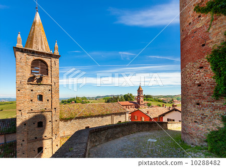 Bell tower and medieval brick wall in small italian town. Bell tower and medieval brick wall in small italian town. 10288482