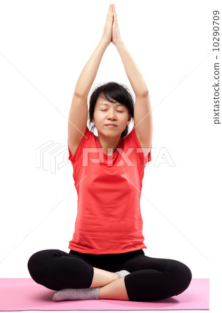 Woman practicing yoga Woman practicing yoga 10290709