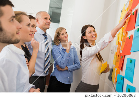 Businesswoman Pointing Labels On Whiteboard Businesswoman Pointing Labels On Whiteboard 10290868