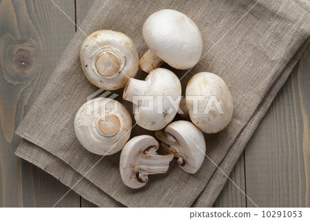 fresh white champignon on wood table fresh white champignon on wood table 10291053
