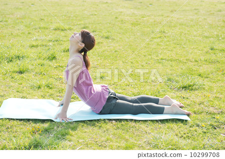 Woman doing yoga in the park Woman doing yoga in the park 10299708
