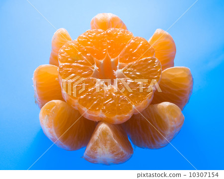 Ripe mandarin on blue background Ripe mandarin on blue background 10307154