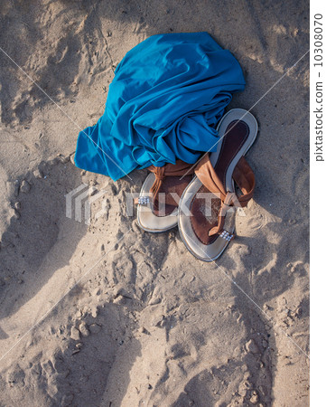 Flip-flops and blue fabric 10308070