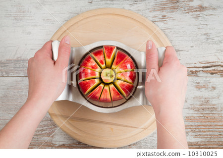 A knife in a red apple A knife in a red apple 10310025