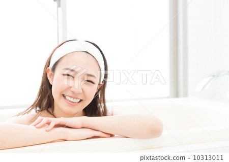 A woman taking a bath A woman taking a bath 10313011
