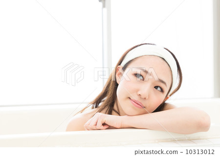 A woman taking a bath A woman taking a bath 10313012