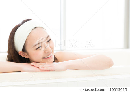 A woman taking a bath A woman taking a bath 10313015