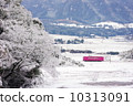 Pink train running in the snowy landscape 10313091