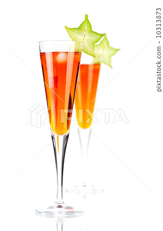 Orange alcohol cocktail with carambola Orange alcohol cocktail with carambola 10313873