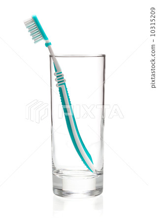 Green tooth brush in glass Green tooth brush in glass 10315209