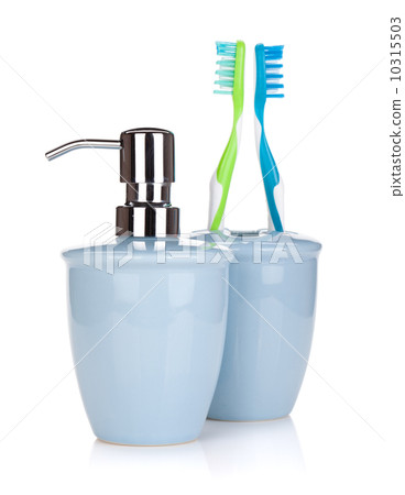 Two colorful toothbrushes and liquid soap 10315503