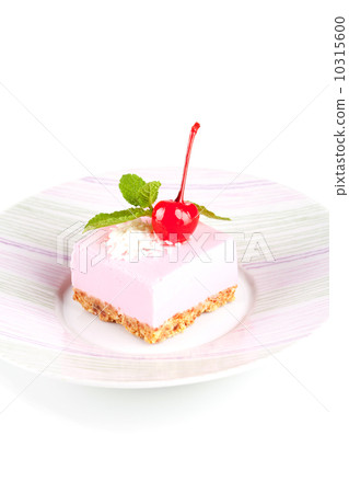 Pink cheesecake with maraschino cherry and mint 10315600