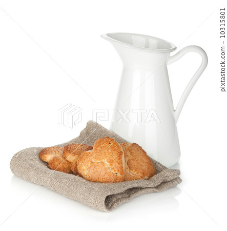 Various cookies and milk jug 10315801