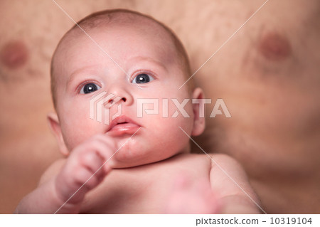 Baby is looking up on daddy's lap Baby is looking up on daddy's lap 10319104