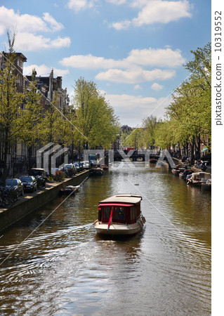 Amsterdam city with boats on canal in Holland 10319552