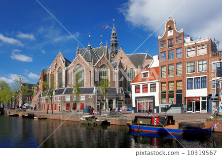Amsterdam city with boats on canal in Holland Amsterdam city with boats on canal in Holland 10319567