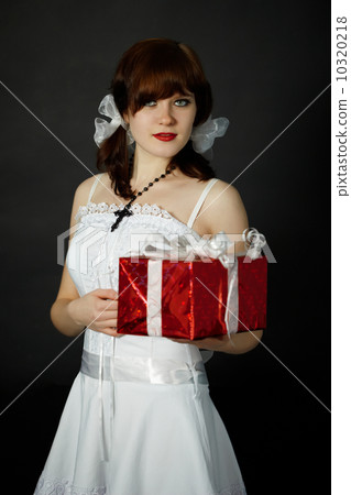 Young woman gives gift Young woman gives gift 10320218