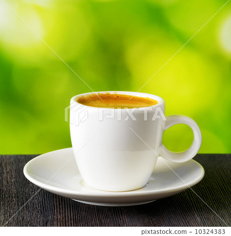 Cup of coffee on nature background Cup of coffee on nature background 10324383