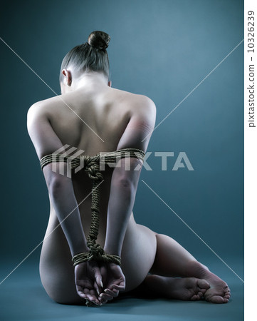 Nude woman with shibari in studio 10326239