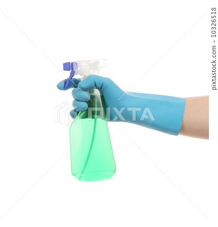 Hand in gloves holds spray bottle. 10326518