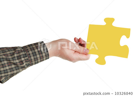male hand with yellow puzzle piece male hand with yellow puzzle piece 10326840