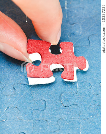 assembling the last red piece of puzzle 10327233
