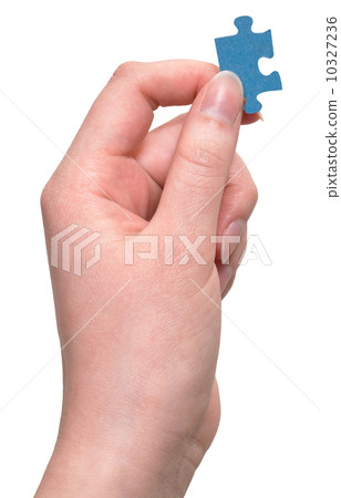 female arm hold jigsaw puzzle piece female arm hold jigsaw puzzle piece 10327236