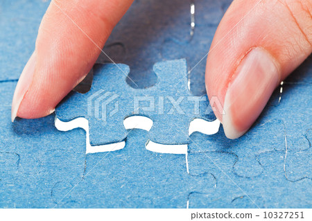 attaching the last blue piece of puzzle attaching the last blue piece of puzzle 10327251