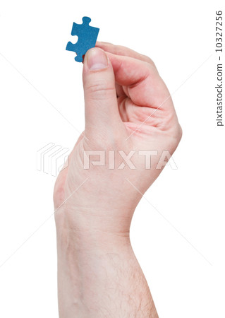 male arm holding jigsaw puzzle piece male arm holding jigsaw puzzle piece 10327256