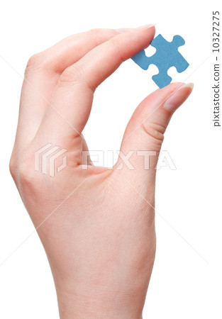 female arm holding blue puzzle piece female arm holding blue puzzle piece 10327275