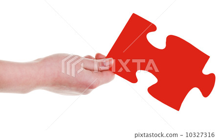 female hand with red puzzle piece female hand with red puzzle piece 10327316