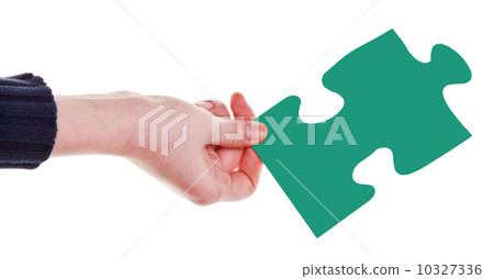female hand with green puzzle piece female hand with green puzzle piece 10327336
