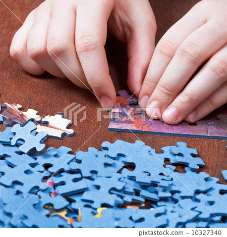 playing with jigsaw puzzles playing with jigsaw puzzles 10327340
