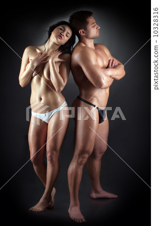 Studio shot of sensual young athletic sex partners 10328316