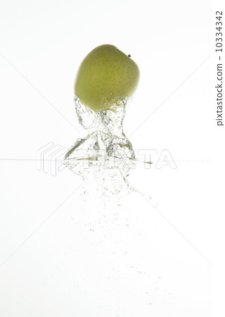 Green jumping out apples 10334342