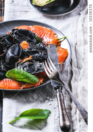 Black ravioli with salted salmon 10336378